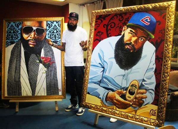Stalley with his portrait and Rick Ross portrait painted by Rà (Maybach Music Group). 